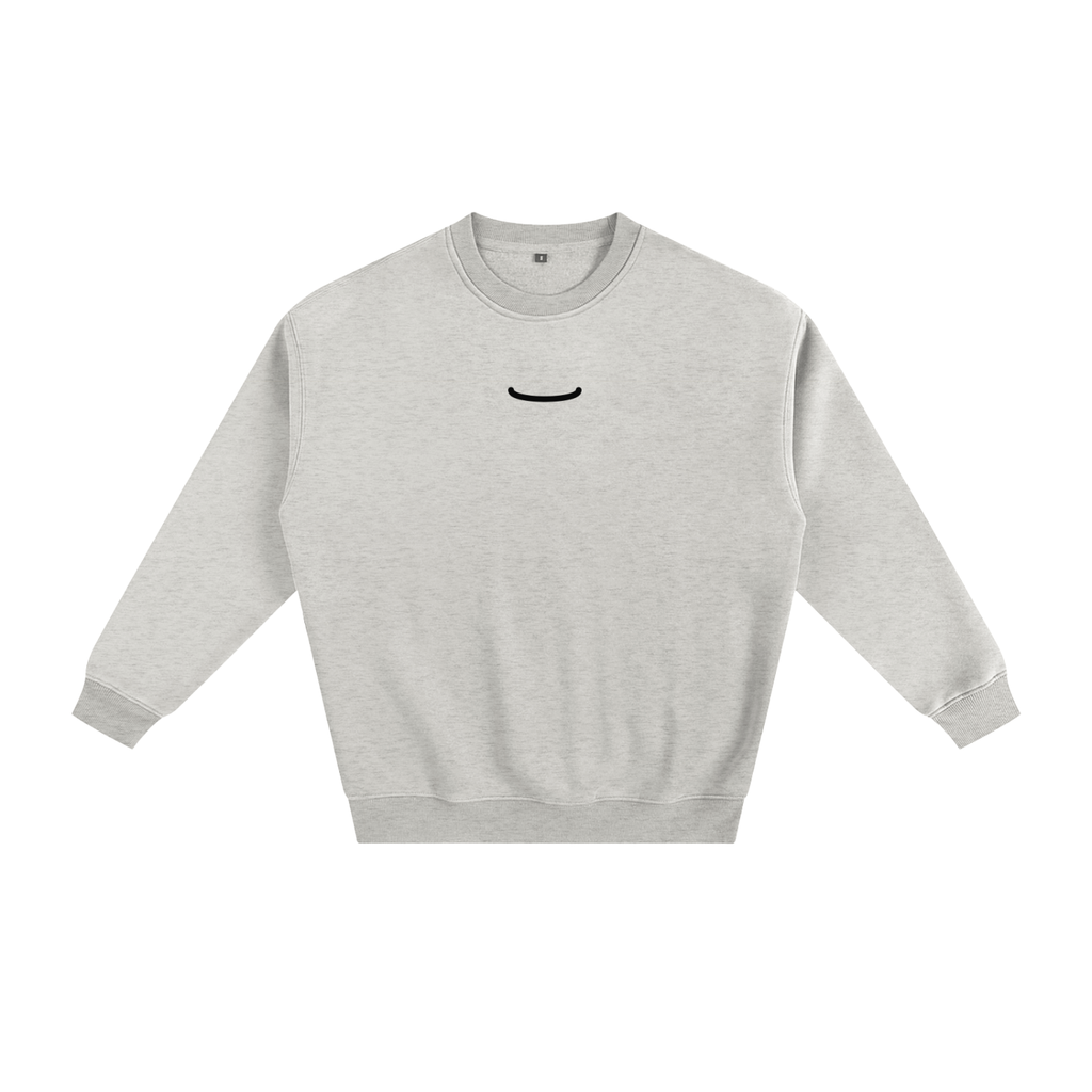 The Arc Crewneck in Oat, front: oat heather heavyweight crewneck sweatshirt with one small ink smile arc centred on the chest