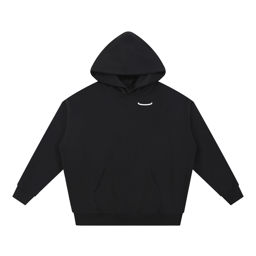 The Arc Hoodie in black, front: a small bone smile arc on the left chest of a heavyweight fleece pullover