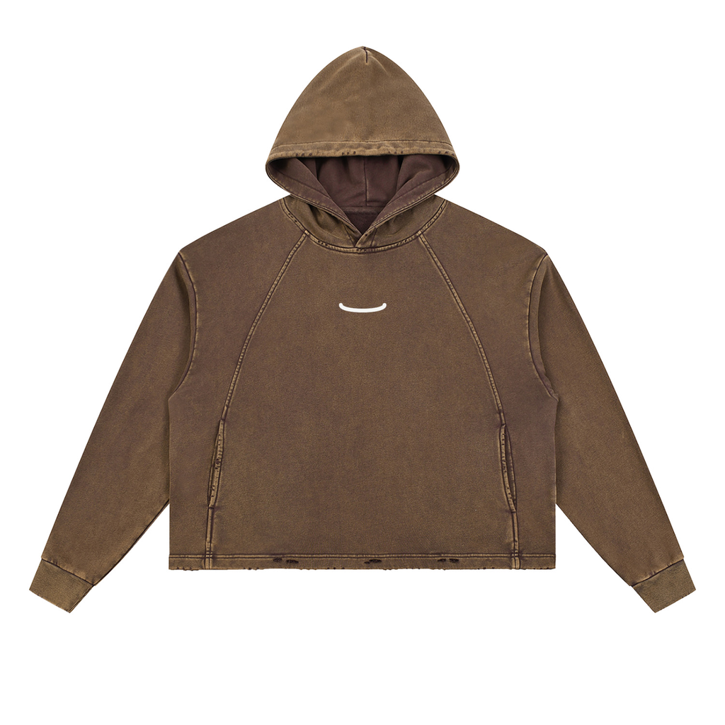 The Washed Hoodie in Brown, front: a small bone arc centred on the chest