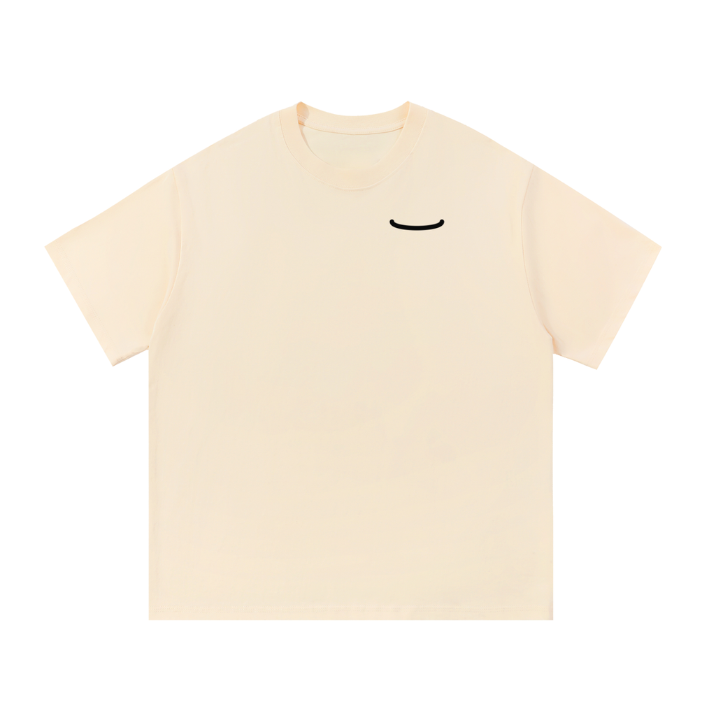 The Arc Tee in bone, front: a small ink smile arc on the left chest of a heavyweight cotton t-shirt