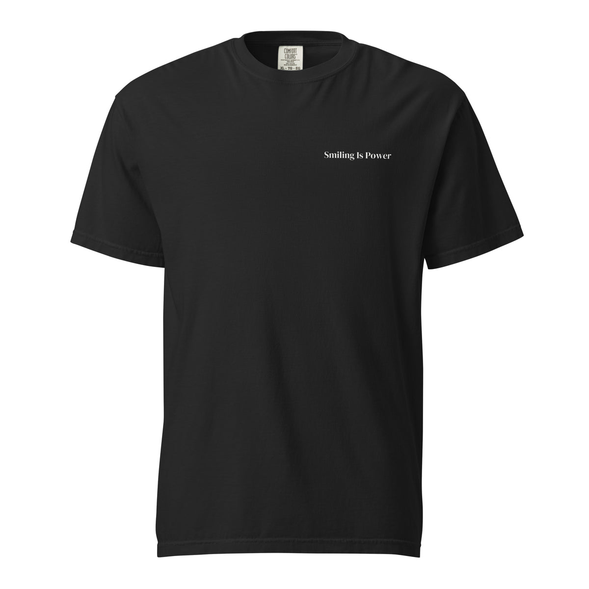 The Quiet Tee in black, front: the Smiling Is Power wordmark printed small in bone on the left chest